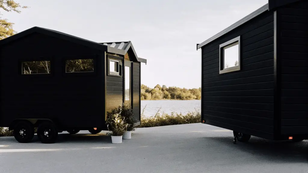 Tiny homes on wheels parked in a serene location.