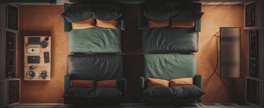 two convertible beds in a dark room
