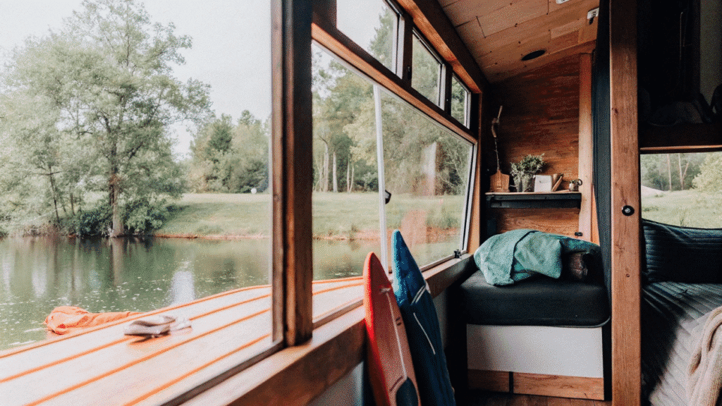 Finger lakes A photograph of a serene natural setting with a view of a wood paneled interior of a rustic cabin like structure