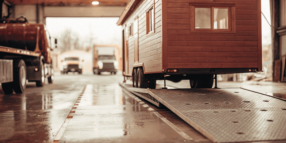 03fc699f875441deabf5a80c5f59c081 Tiny house trailer on a scale at weigh station