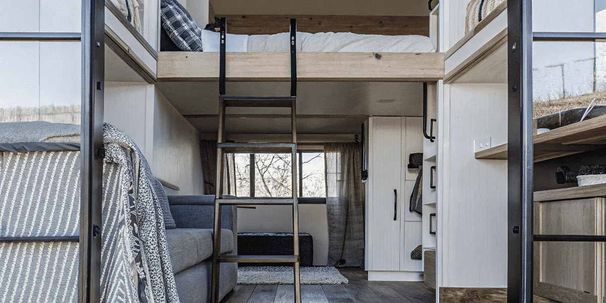 1c7aa128c6fb42e0bba10c585ed2e275 Cozy tiny house interior with multi functional furniture and loft area