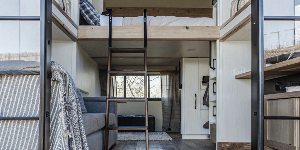 1c7aa128c6fb42e0bba10c585ed2e275 Cozy tiny house interior with multi functional furniture and loft area