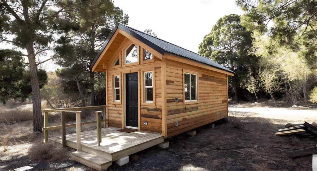Affordablechalettinyhouse A chalet tiny house in a wooded area