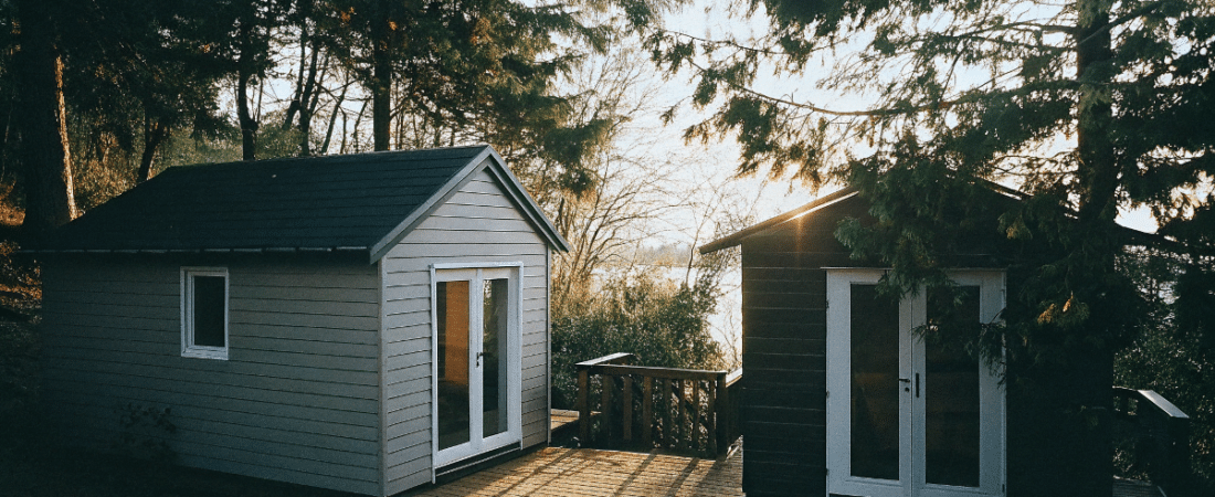 Connected tiny houses next to trees
