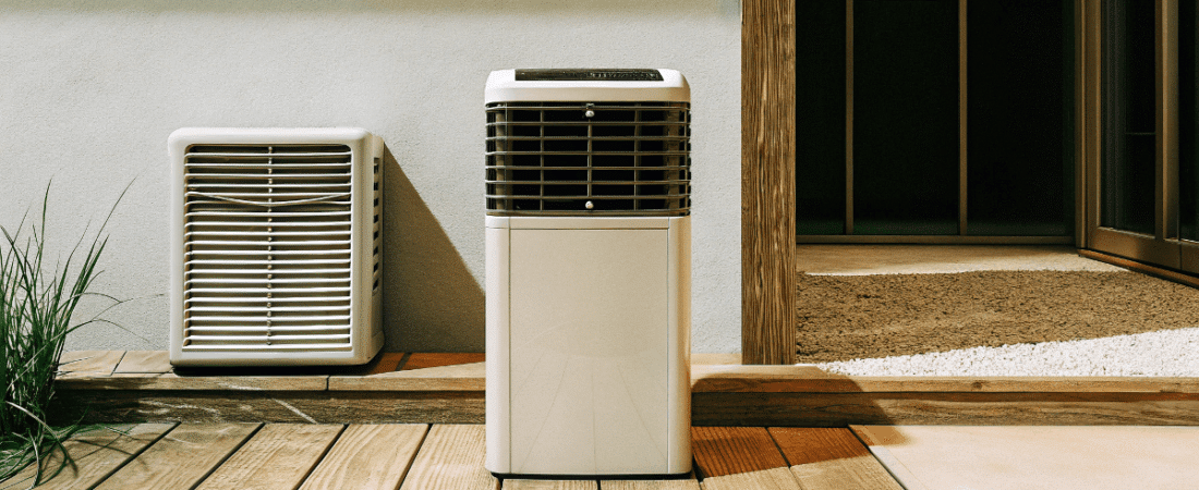 A photo of a modern outdoor setting featuring a white portable heating unit on a wooden deck