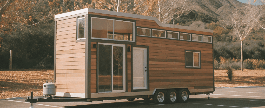 Tiny house on wheels in a scenic location with modern design