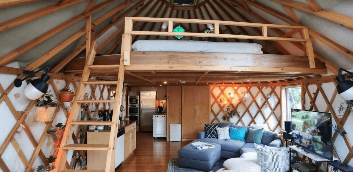 2a29d958cb5842cfad5cad93890492fd A photograph showcasing an interior space with a cozy rustic aesthetic The image is taken in a setting with a wood tiled ceiling reminiscent of a wooden hut