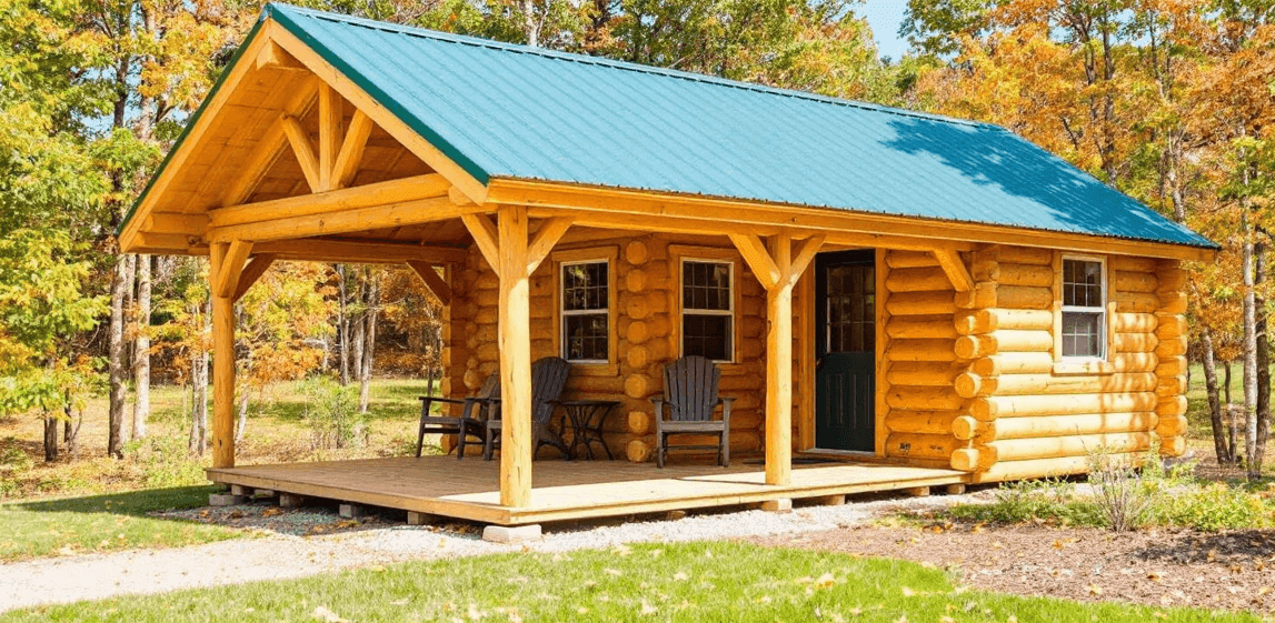 2d7db63494b1476da98e0fd125bb5dc4 A photograph of a rustic wooden cabin style home nestled within a forested area during autumn