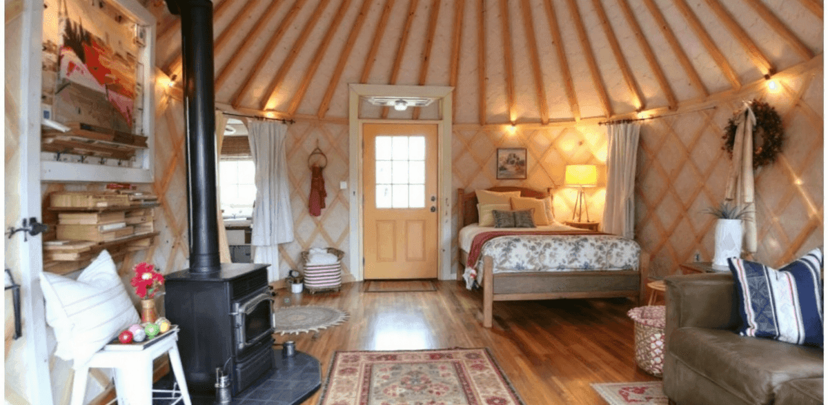459bcecb9ee241d19cb3dbb01d8b431d A cozy warm and rustic interior inspired by a traditional Mongolian yurt featuring a close up of a cozy dwelling with wooden elements and earthy tones
