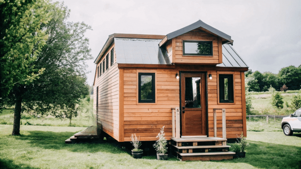 Image This image showcases the MAHOGANY barn style tiny home featuring two spacious bedrooms and a full kitchen constructed with premium mahogany wood The design emphasizes a cozy and functional layout ideal for families or creative spaces