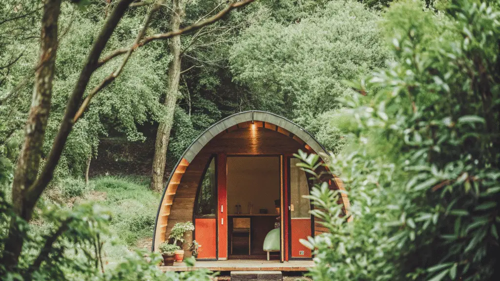 Arched cabins A unique arched prefab cabin with a curved roof rustic exterior and a cozy interior