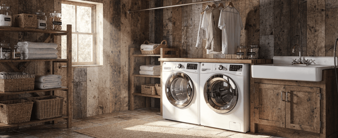 Rustic laundry room ideas A cozy laundry room with two white washing machines a sink and wooden shelves with towels