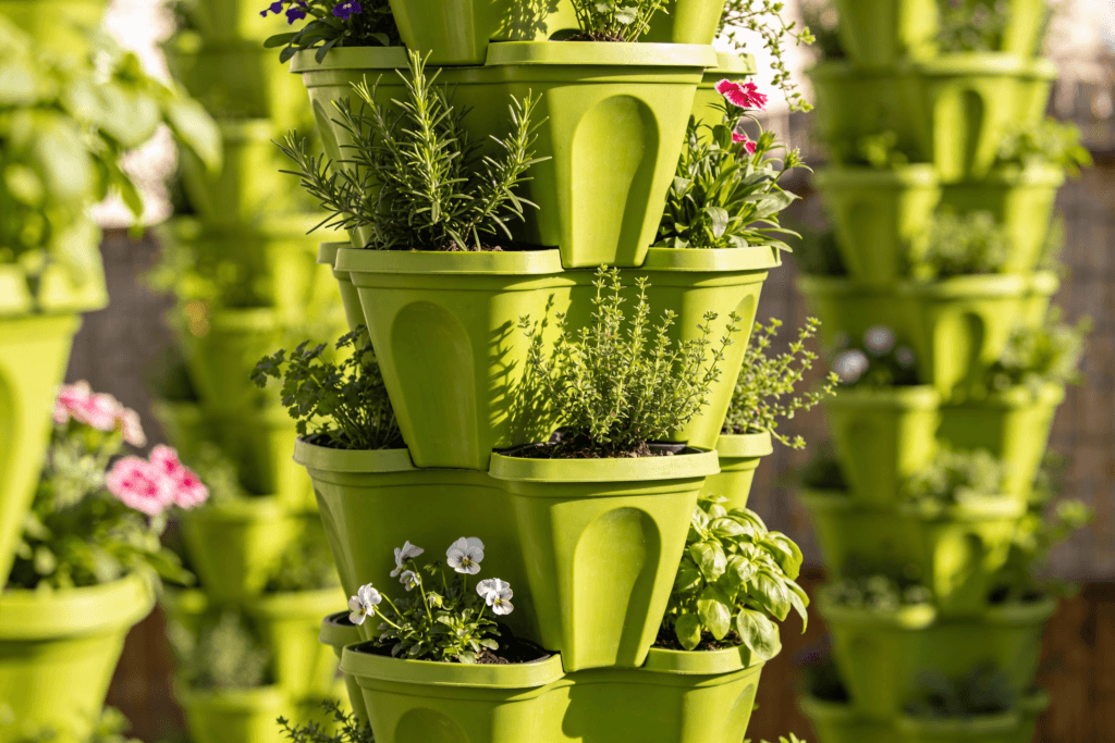 Green pots stacked with flowers