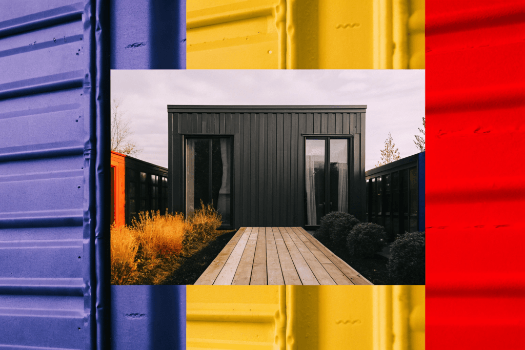 Shipping container chic Photograph of a modern dark grey shipping container home or office with a wooden deck and lush landscaping set against a raw industrial concrete backdrop