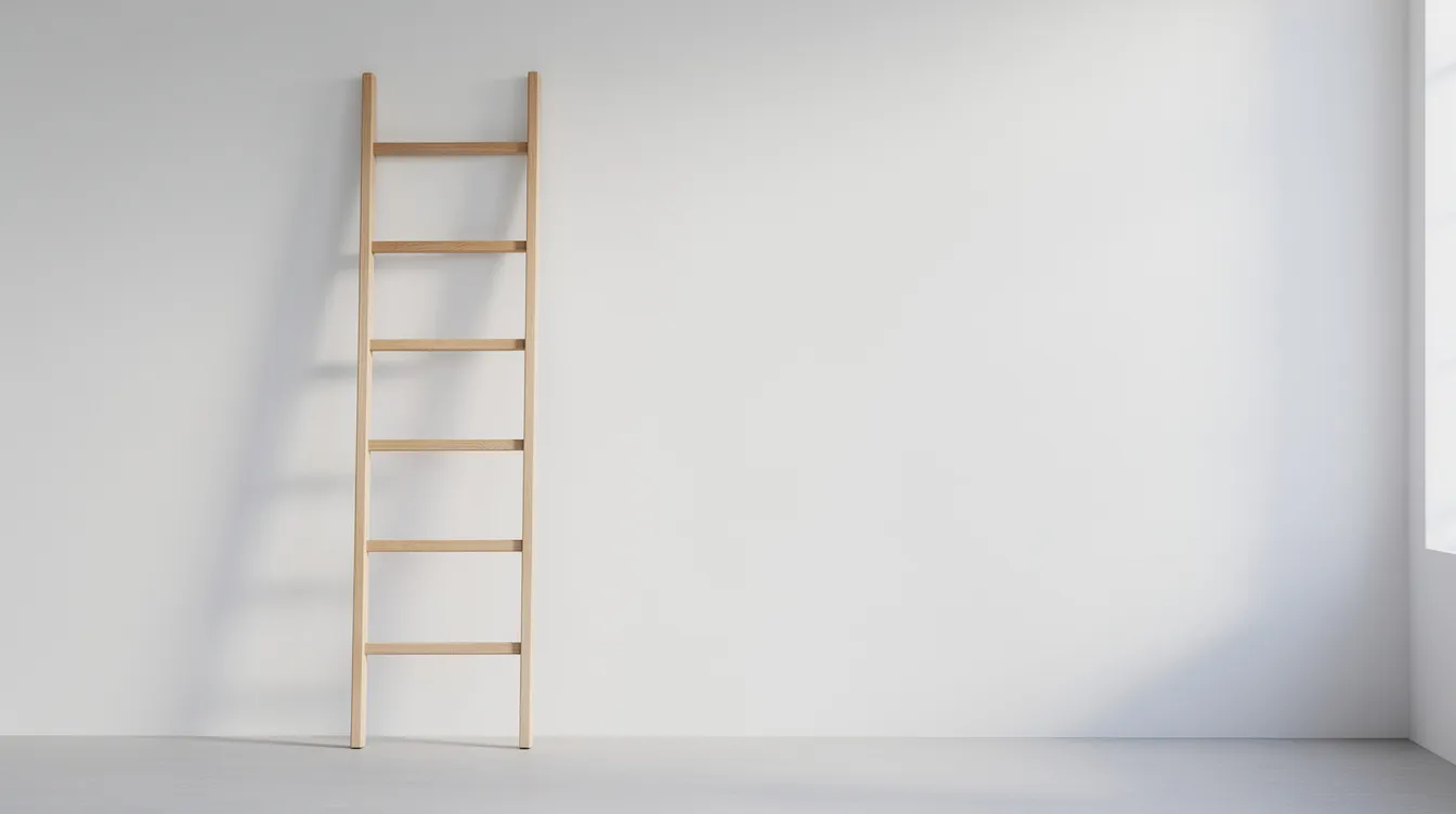 E2ca5c54862543d9947c9103791b3227 A simple wooden ladder is mounted against a white wall in a minimalist room providing easy access to a tiny house loft This design showcases a practical solution for maximizing vertical space in small living areas