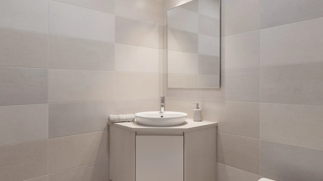 2de55df488d44a8fab90d10f4b076f0d The image features a compact corner bathroom vanity with a sleek ceramic basin perfectly suited for small bathroom spaces The neutral tile walls complement the vanity cabinet which includes storage options like doors and drawers making it a functional addition to any bathroom