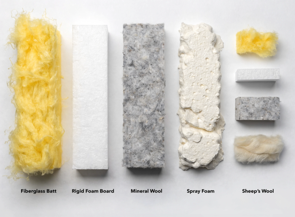 Insulated materials Display of multiple insulation materials fiberglass batt rigid foam board mineral wool spray foam and sheeps wool