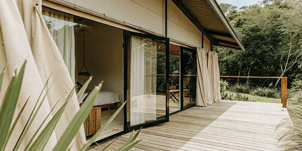 Explore tiny house exterior deck view Tiny house with large glass sliding doors and a spacious outdoor deck