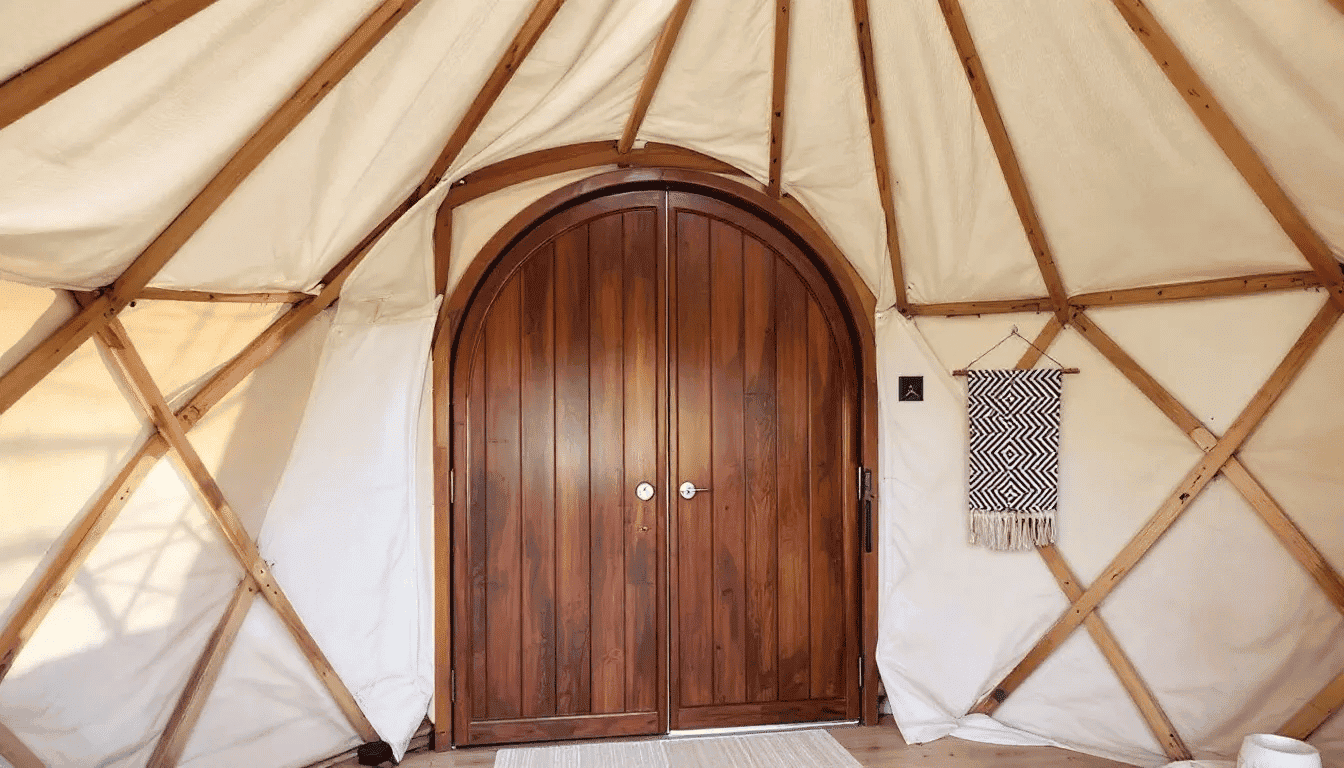 Explore tiny house interior door Wooden interior door inside a tiny house with canvas walls